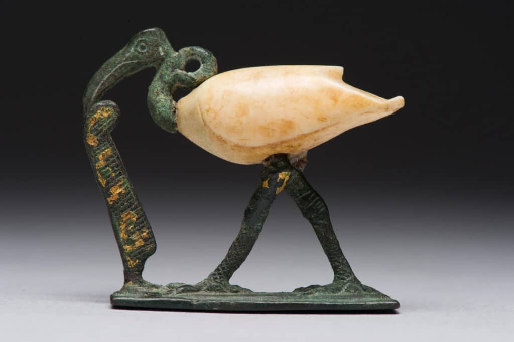 Figure of a striding ibis. Late Period to Ptolemaic Period, 664-30 BCE. Copper alloy, travertine, and gold. [ECM 1692]