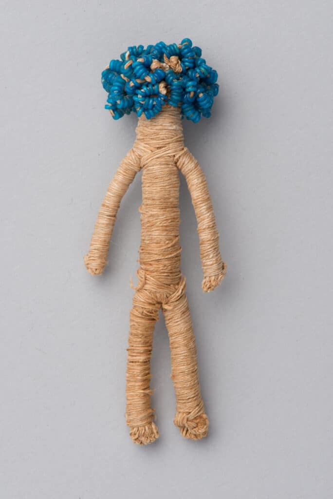 String figure with glass beaded hair, First Intermediate Period, 2160–2055 BCE. [ECM 1843]