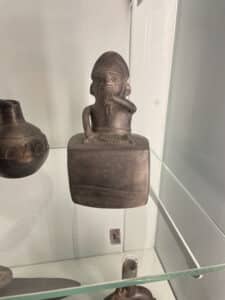 Peruvian vessel should a person playing an instrument